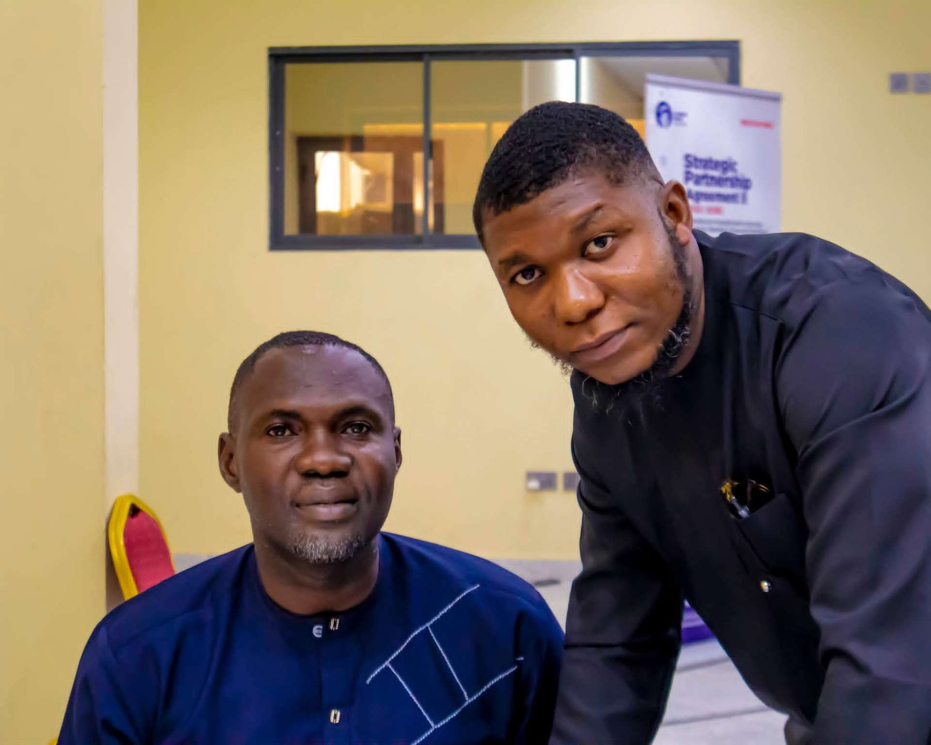 Comrade Ini-obong Uko with a fellow delegate at the dialogue venue